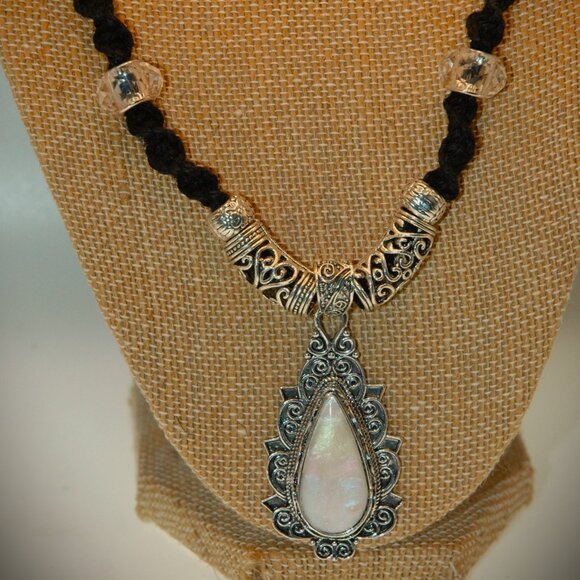 Elegant Opalescence Teardrop Cabochon on a 20" Handmade Black Hemp Necklace - Picture 1 of 7